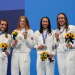 The United States womens 4x100-meter medley relay team, Regan Smith, Lydia Jacoby, Torri Huske and Abbey Weitzeil, celebrates at the podium after winning the silver medal at the 2020 Summer Olympics, Sunday, Aug. 1, 2021, in Tokyo, Japan. (AP Photo/Gregory Bull)