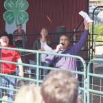 Peninsula Clarion file
Auctioneers Andy Kriner, left, and Rayne, Reynolds celebrate a successful sale during the 4-H Junior Market Livestock Auction at the Kenai Peninsula Fair on Aug. 17, 2019 at the fairgrounds in Ninilchik.