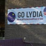 A banner supporting Olympic swimmer Lydia Jacoby hangs outside of First National Bank Alaska in her hometown of Seward on Saturday, July 24, 2021. (Camille Botello/Peninsula Clarion)