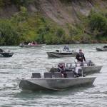 Guides with the Kenai River Sportfish Association wait in their boats on the Kenai River in Soldotna on Wednesday, Aug. 11, 2021. (Camille Botello/Peninsula Clarion)