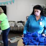 Shari Conner, a coalition coordinator for Change 4 the Kenai, adjusts a box of Narcan kits on Thursday, Aug. 12, 2021 at Freedom House in Soldotna, Alaska. (Ashlyn OHara/Peninsula Clarion)