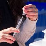 A registered nurse prepares a COVID-19 vaccine at the pop-up clinic on the Spit on May 27. (Photo by Sarah Knapp/Homer News)