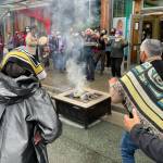 Michael S. Lockett / Juneau Empire
Participants burn an example of a commercial garment that led to a now-settled intellectual property lawsuit in a ceremony commemorating the settlement with the fashion company on Friday, Aug. 13, 2021.
