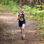 Homer junior Seamus McDonough runs to victory in the junior-senior race at the Nikiski Class Races on Monday, Aug. 16, 2021, at Nikiski High School in Nikiski, Alaska. (Photo by Jeff Helminiak/Peninsula Clarion)