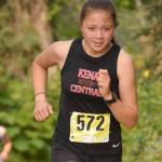 Kenai Central sophomore Emilee Wilson runs to victory in the freshmen-sophomore girls race in the Nikiski Class Races on Monday, Aug. 16, 2021, at Nikiski High School in Nikiski, Alaska. (Photo by Jeff Helminiak/Peninsula Clarion)