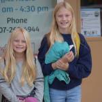 Tynlee, fourth grade, and Taylen Moore, sixth grade, head into Sterling Elementary on their first day of school on Tuesday, August 17, 2021. (Camille Botello / Peninsula Clarion)