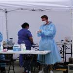 Healthcare workers with Capstone Clinic staff a pop-up COVID-19 testing clinic on Monday, Aug. 16, 2021, at the Homer Public Library in Homer, Alaska. The clinic offers same-day testing from noon-7:30 p.m. today and noon-4 p.m. Friday. (Photo by Michael Armstrong/Homer News).