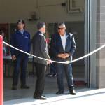 State Sen. Peter Micciche (left) and Kenai Peninsula Borough Mayor Charlie Pierce prepare to cut the ribbon at Nikiski Fire Station 3 on Friday, Aug. 20, 2021 in Nikiski, Alaska. (Ashlyn OHara/Peninsula Clarion)