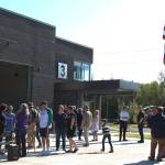People gather outside of Nikiski Fire Station 3 on Friday, Aug. 20, 2021 in Nikiski, Alaska. (Ashlyn OHara/Peninsula Clarion)