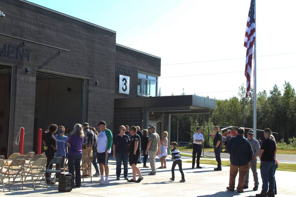 People gather outside of Nikiski Fire Station 3 on Friday, Aug. 20, 2021 in Nikiski, Alaska. (Ashlyn OHara/Peninsula Clarion)