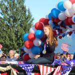 Ashlyn OHara/Peninsula Clarion
Olympic gold medalist Lydia Jacoby waves to the crowd in Seward during a celebratory parade on Aug. 5.