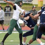 Service quarterback Coen Niclai throws under pressure from Soldotnas Jeren Nash on Friday, Sept. 3, 2021, at Justin Maile Field in Soldotna, Alaska. (Photo by Jeff Helminiak/Peninsula Clarion)