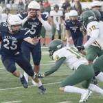 Soldotna's Gehret Medcoff rushes against Service at Justin Maile Field on Friday, Sept. 3, 2021, in Soldotna, Alaska. (Photo by Camille Botello/Peninsula Clarion)