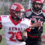 Kenai’s James Sparks runs for a gain after a catch during a loss to Houston on Friday, Sept. 3, 2021, in Houston, Alaska. (Photo by Jeremiah Bartz/Frontiersman)
