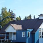 A worker paints a steeple white at the Kenai United Methodist Church on Monday, Sept. 6, 2021 in Kenai, Alaska. (Ashlyn O'Hara/Peninsula Clarion)