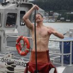 Army Pfc. Dylan Kloss rinses off after a dive in downtown Juneau as part of training for the engineer divers with a Coast Guard dive team on Sept. 6, 2021. (Courtesy photo / MyKenzie Robertson)