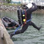 Army Pfc. Luke McCarty jumps in the water during training for the engineer divers with a Coast Guard dive team on Sept. 6, 2021. (Courtesy photo / MyKenzie Robertson)