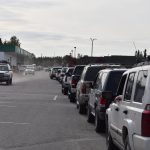 Cars line up outside of Capstone Clinics COVID-19 testing site in Kenai, Alaska on Tuesday, Sept. 7, 2021. The line extended through the Three Bears Grocery parking lot, and past the entrances to OReilly Auto Parts and Aspen Extended Stay Suites. Some said they waited for three and a half hours to get tested, and others said the line stretched down and around Walker Lane Tuesday morning. (Camille Botello/Peninsula Clarion)