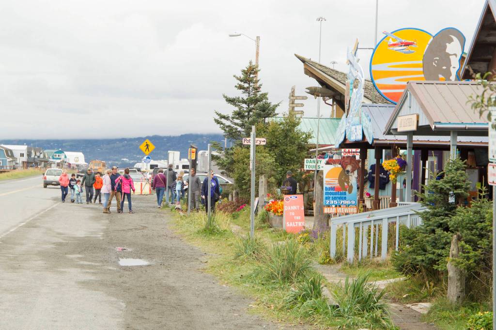 Visitors explore shops on the Homer Spit before the upcoming end of the season. (Photo by Sarah Knapp/Homer News)