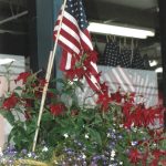 Twenty years ago after the attacks of Sept. 11, 2001, displays of U.S. flags were common, as seen here at NOMAR in Homer the week after the attacks. (Homer News file photo)