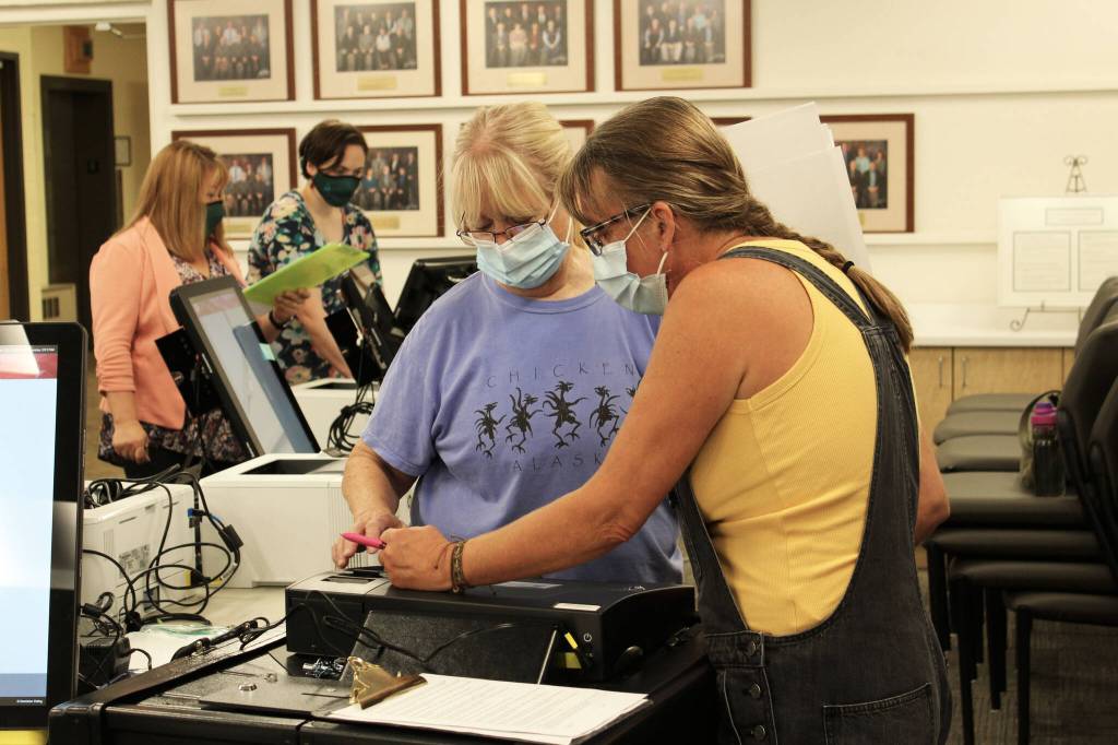 Linda Cusack (left) and Teri Birchfield (right) test a Dominion voting machine ahead of the Oct. 5 municipal election on Thursday, Sept. 9, 2021 in Soldotna, Alaska. (Ashlyn OHara/Peninsula Clarion)