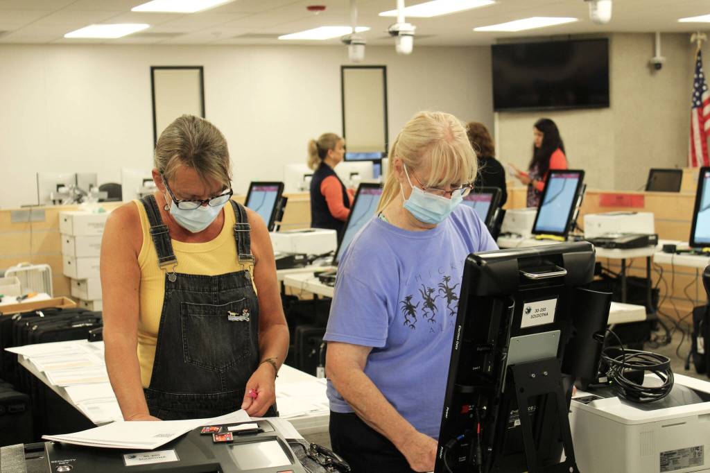 Teri Birchfield (left) and Linda Cusack (right) test a Dominion voting machine ahead of the Oct. 5 municipal election on Thursday, Sept. 9, 2021 in Soldotna, Alaska. (Ashlyn OHara/Peninsula Clarion)