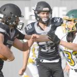 Nikiski's Truit McCaughey tries to run through the tackle of Seward's Gideon Schrock on Friday, Sept. 10, 2021, at Nikiski High School. (Photo by Jeff Helminiak/Peninsula Clarion)