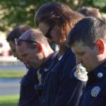 Firefighters bow their heads during the 20th memorial service of the 9/11 terrorist attacks at Central Emergency Services in Soldotna on Saturday, Sept. 11, 2021. (Camille Botello/Peninsula Clarion)