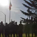 Firefighters pay their respects during the 20th memorial service of the 9/11 terrorist attacks at Central Emergency Services in Soldotna on Saturday, Sept. 11, 2021. (Camille Botello/Peninsula Clarion)