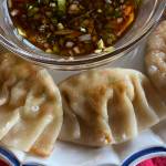 Cooked by a combination of pan frying and steaming, delicate tofu and vegetable dumplings require a delicate hand and patience. (Photo by Tressa Dale/Peninsula Clarion)