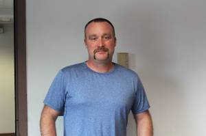 Alex Douthit stands in the Peninsula Clarion building on Sept. 9, 2021 in Kenai, Alaska. (Ashlyn OHara/Peninsula Clarion)