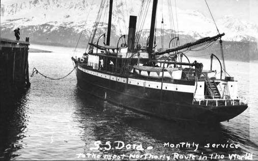 This undated photo shows the stern of the S.S. Dora near a dock on her northerly mail route. (Alaska State Library photo collection)
