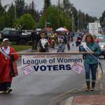 Members of the League of Women Voters wave to the crowd during the Soldotna Progress Days parade on Saturday, July 24, 2021. (Camille Botello / Peninsula Clarion)
