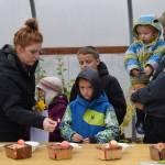 The Tonione family tastes apples at OBrien Garden and Trees in Nikiski, Alaska, on Saturday, Sept. 25, 2021. (Camille Botello/Peninsula Clarion)