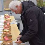 Mike OBrien works the apple tasting at OBrien Garden and Trees in Nikiski, Alaska on Saturday, Sept. 25, 2021. (Camille Botello/Peninsula Clarion)