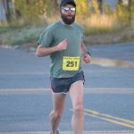 Mens half marathon winner Patrick Lewis runs through Kenai, Alaska, during the Kenai River Marathon on Sunday, Sept. 26, 2021. (Photo by Jeff Helminiak/Peninsula Clarion)