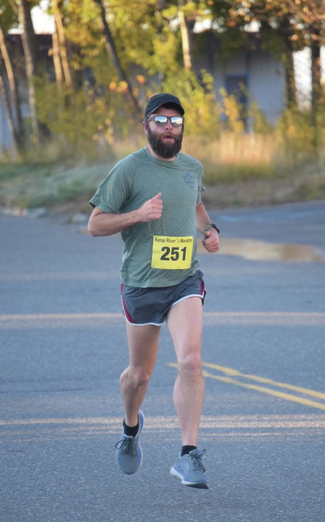 Mens half marathon winner Patrick Lewis runs through Kenai, Alaska, during the Kenai River Marathon on Sunday, Sept. 26, 2021. (Photo by Jeff Helminiak/Peninsula Clarion)