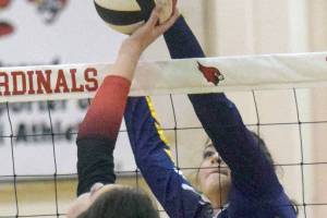 Kenai Central's Brooke Ashley and Homer's Nevaeh Diaz tangle at the net at Kenai Central High School on Thursday, Sept. 30, 2021, at Kenai Central High School. (Photo by Jeff Helminiak/Peninsula Clarion)