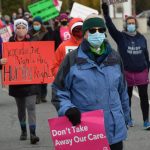 Demonstrators march through Soldotna as part of the national Womens March Rally for Abortion Justice on Saturday, Oct. 2, 2021. (Camille Botello/Peninsula Clarion)