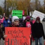 Demonstrators march through Soldotna as part of the national Womens March Rally for Abortion Justice on Saturday, Oct. 2, 2021. (Camille Botello/Peninsula Clarion)