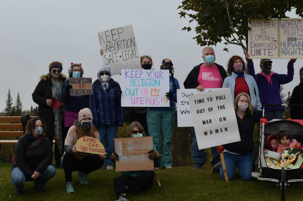 Demonstrators gather in Soldotna Creek Park as part of the national Womens March Rally for Abortion Justice on Oct. 2, 2021. (Camille Botello/Peninsula Clarion)