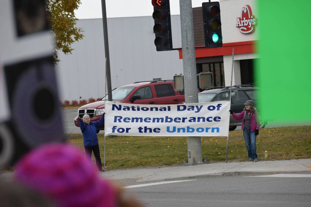 Anti-abortion counterprotestors gather in downtown Soldotna during the national Womens March Rally for Abortion Justice on Oct. 2, 2021. (Camille Botello/Peninsula Clarion)
