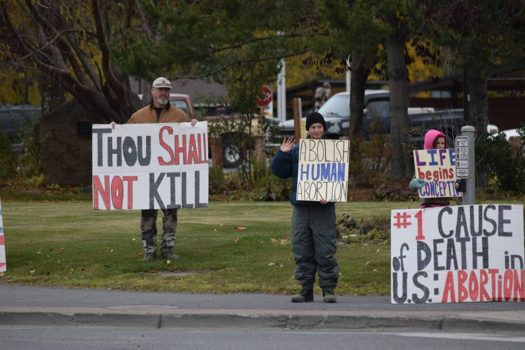 Anti-abortion counterprotestors gather in downtown Soldotna during the national Womens March Rally for Abortion Justice on Oct. 2, 2021. (Camille Botello/Peninsula Clarion)