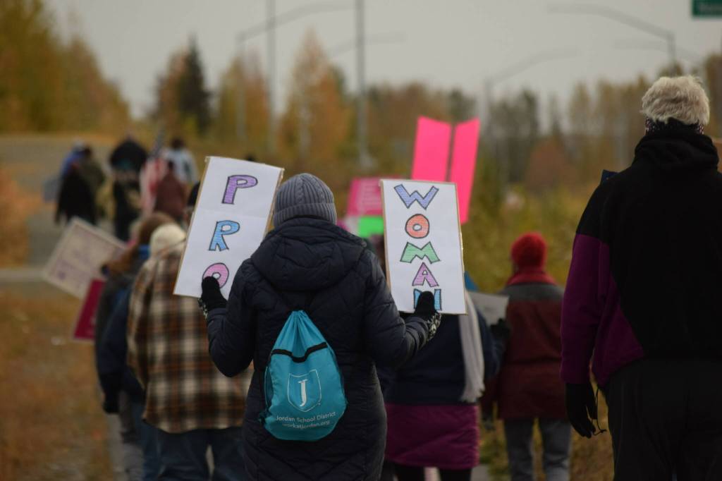 Demonstrators march through Soldotna as part of the national Womens March Rally for Abortion Justice on Saturday, Oct. 2, 2021. (Camille Botello/Peninsula Clarion)