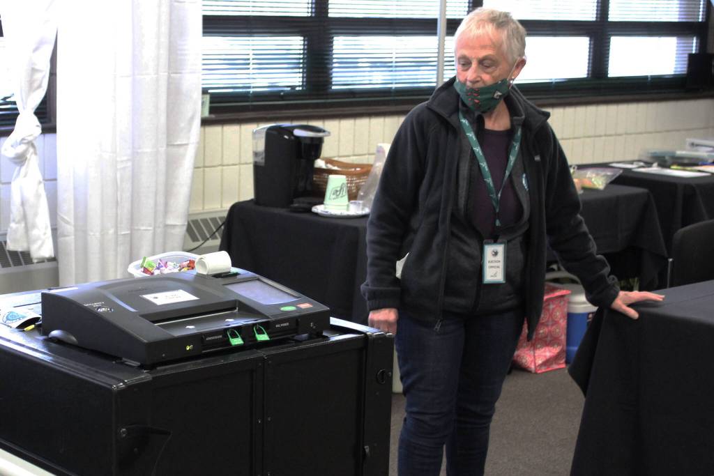 Anna Traylor oversees voting equipment at the Soldotna Regional Sports Complex on Tuesday, Oct. 5, 2021 in Soldotna, Alaska. (Ashlyn OHara/Peninsula Clarion)