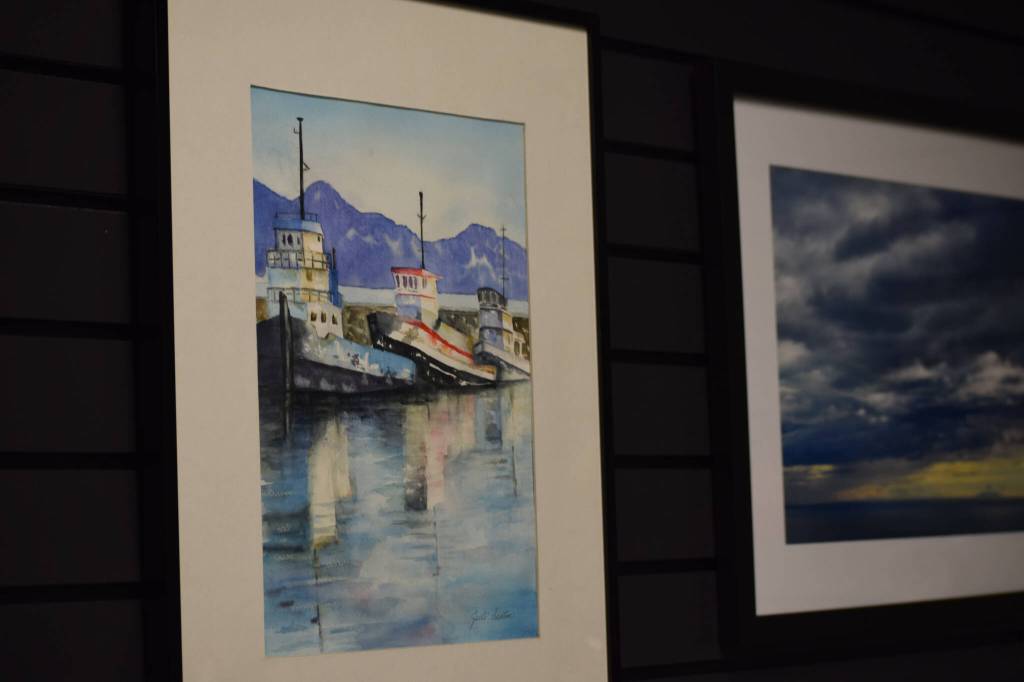 Pieces hang on display at the Kenai Art Center for the open call show on Wednesday, Oct. 6, 2021 in Kenai, Alaska. (Camille Botello/Peninsula Clarion)