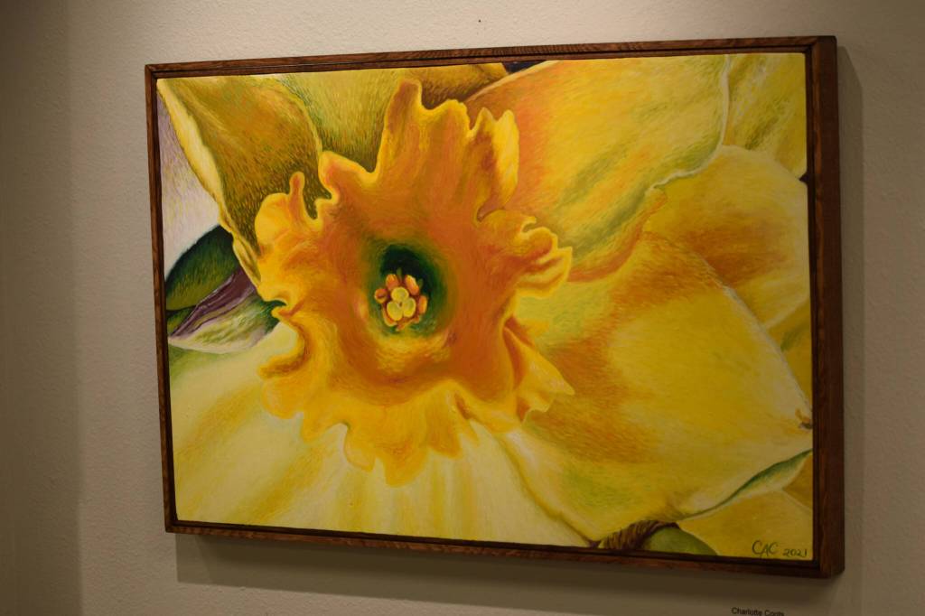 Pieces hang on display at the Kenai Art Center for the open call show on Wednesday, Oct. 6, 2021 in Kenai, Alaska. (Camille Botello/Peninsula Clarion)