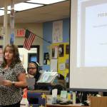 KPBSD Finance Director Elizabeth Hayes (left) gives a presentation on the school districts FY23 budget at Soldotna High School on Thursday, Oct. 8, 2021 in Soldotna, Alaska. (Ashlyn OHara/Peninsula Clarion)
