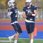 Brayden Taylor and Brock Wilson celebrate Wilsons touchdown run Friday, Oct. 8, 2021, at Justin Maile Field in Soldotna, Alaska. (Photo by Jeff Helminiak/Peninsula Clarion)