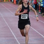 Jayna Boonstra of Kenai races her way to another Division II state cross-country championship at Bartlett High School in Anchorage, Alaska, on Saturday, Oct. 9, 2021. Boonstra finished 5 kilometers in 19 minutes, 47 seconds, to win the sixth individual state title in the last 10 years for the Kardinals girls program. (Camille Botello/Peninsula Clarion)